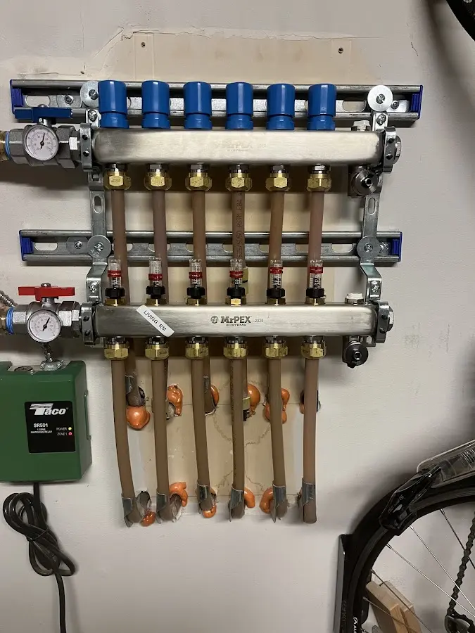 Plumber performing Water Heater Repair at a residential property in Boscawen